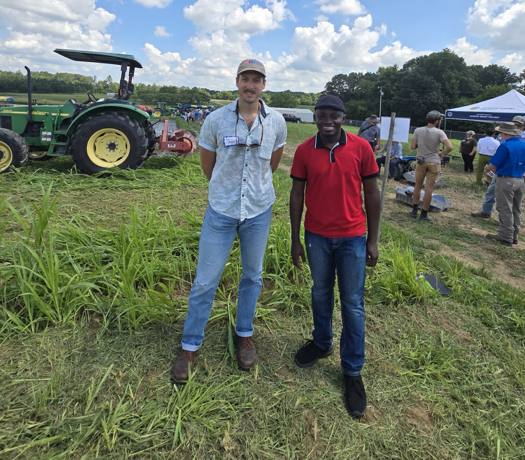 Extension Associate Austin Menker and Summer Student Worker Joseph Opoku Gakpo at the Farmers Field Day